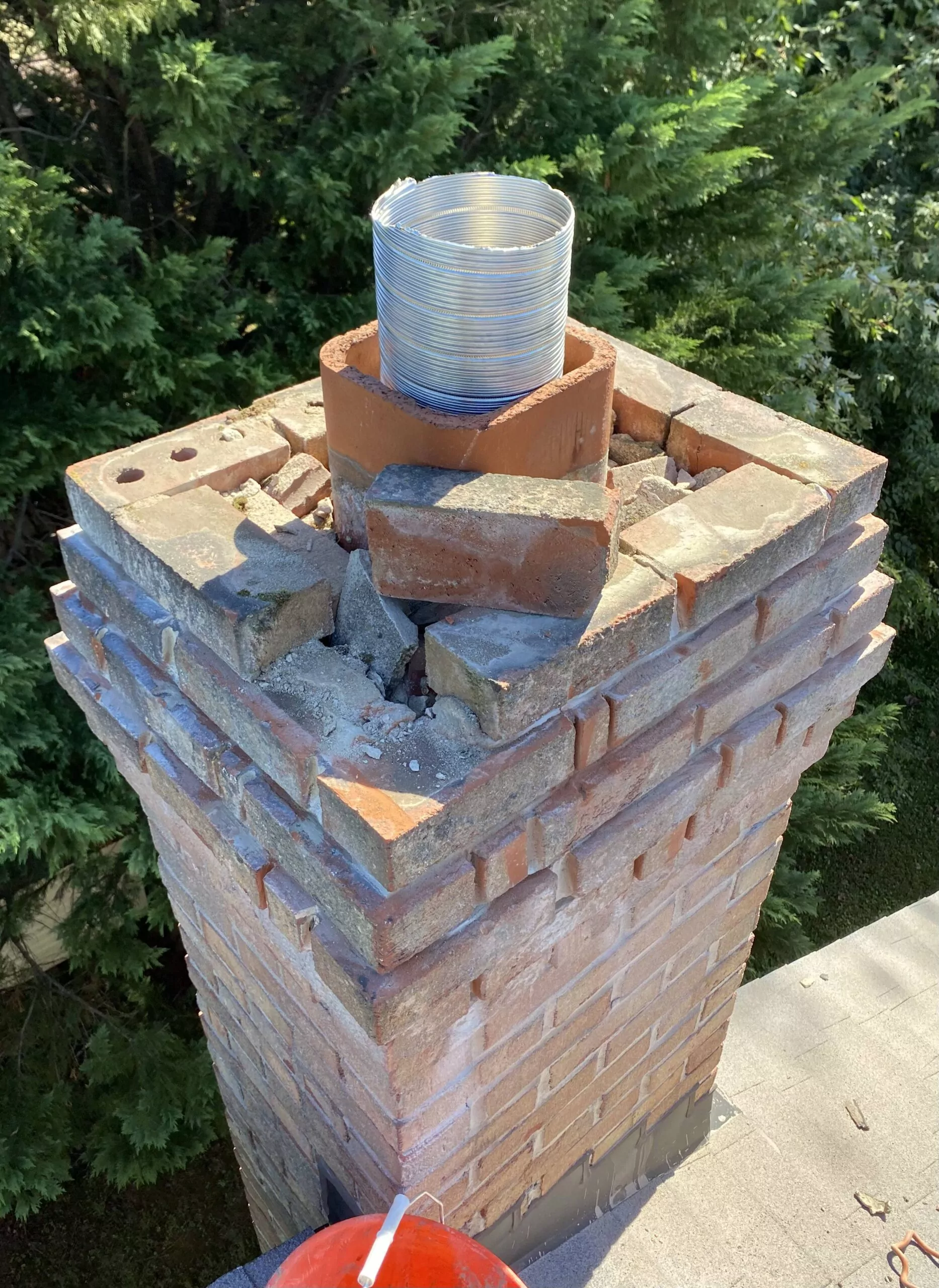 Damaged chimney crown requiring professional repair by S.O. Chimney Burlington