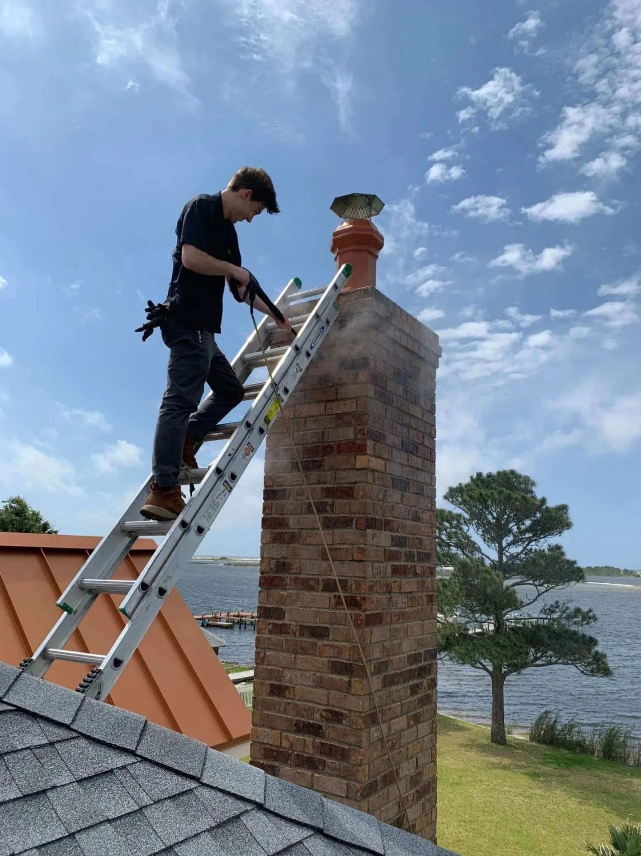 Professional chimney sweep cleaning demonstration by S.O. Chimney Burlington