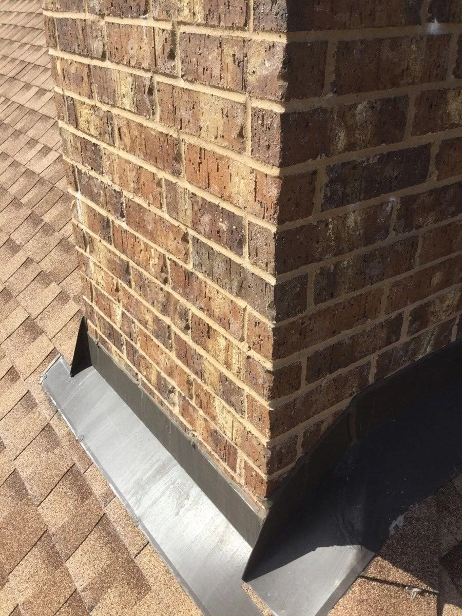 Damaged chimney flashing requiring repair by S.O. Chimney Burlington